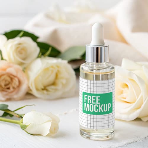 Clear Dropper Bottle Mockup PSD — Luxury Skincare Packaging with Roses Setting