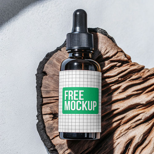 Amber Dropper Bottle Mockup PSD — Apothecary Packaging on Rustic Wood