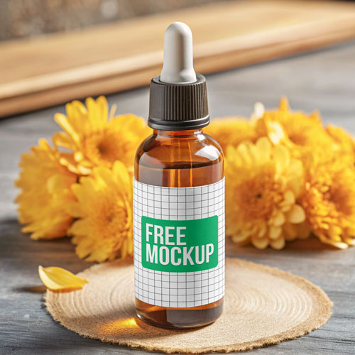 Amber Dropper Bottle Mockup PSD — Herbal Wellness Packaging with Flowers