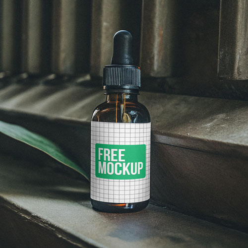 Industrial Amber Dropper Bottle Mockup PSD — Rugged Grooming Packaging Display